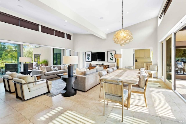 living room featuring beam ceiling, a notable chandelier, a high ceiling, and light tile patterned floors