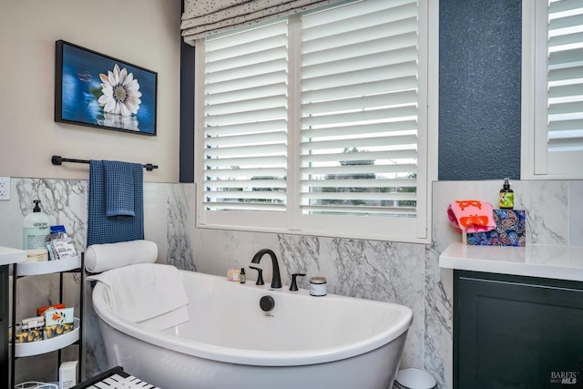 bathroom with tile walls and a tub