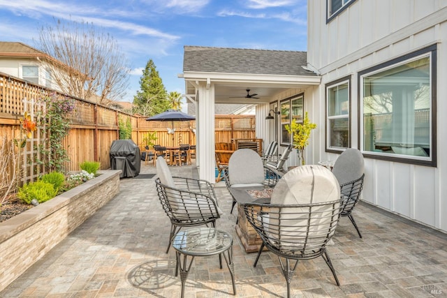 view of patio featuring area for grilling and ceiling fan