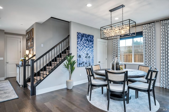 dining space with a chandelier and dark hardwood / wood-style floors