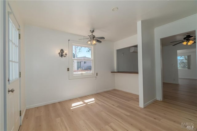 interior space with light wood-type flooring and ceiling fan