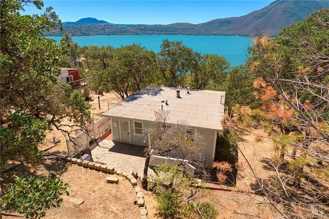 aerial view featuring a water and mountain view