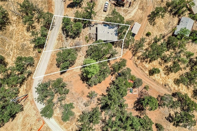 birds eye view of property with a rural view