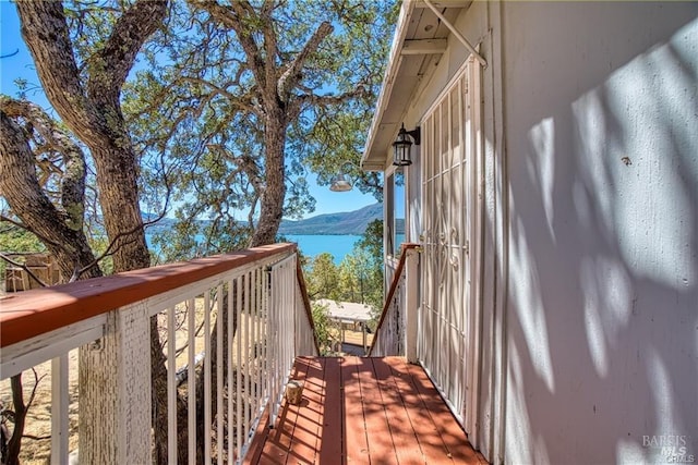 exterior space with a water and mountain view