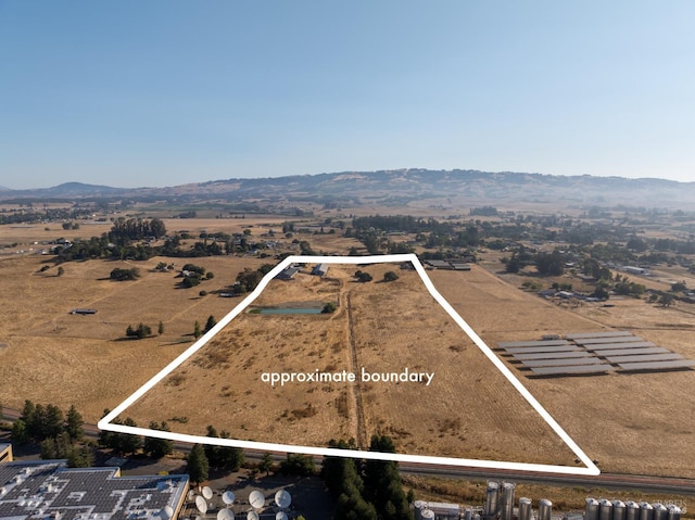 aerial view featuring a rural view and a mountain view