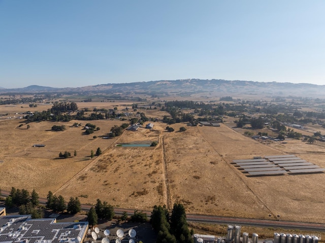 drone / aerial view featuring a mountain view and a rural view