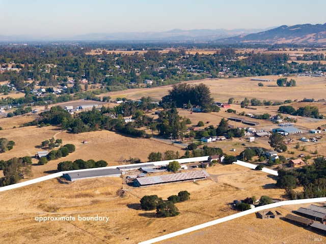 bird's eye view featuring a rural view and a mountain view