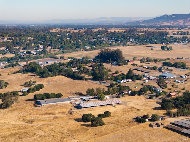 birds eye view of property featuring a mountain view and a rural view