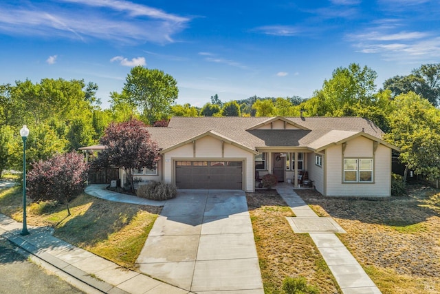 single story home with a garage and a front lawn