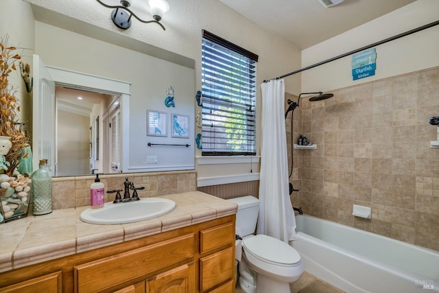 full bathroom with backsplash, vanity, shower / bath combo, and toilet