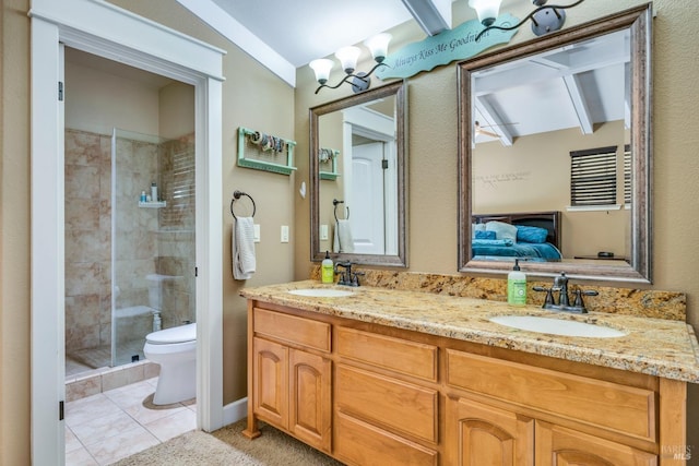 bathroom with tile patterned flooring, vaulted ceiling, toilet, a shower with door, and vanity