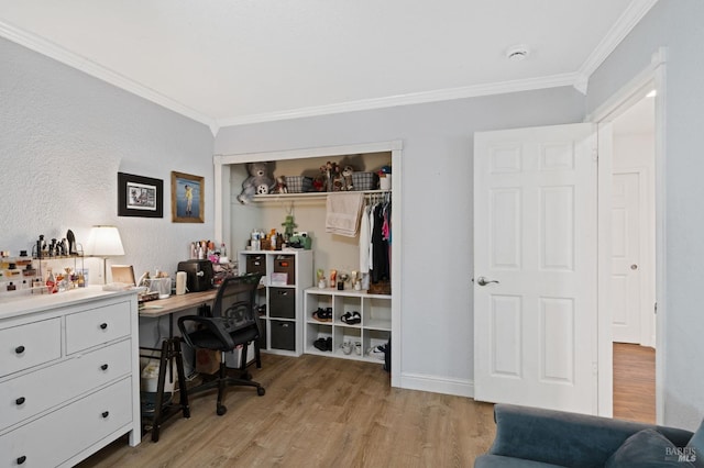 office space with baseboards, light wood-style floors, and crown molding