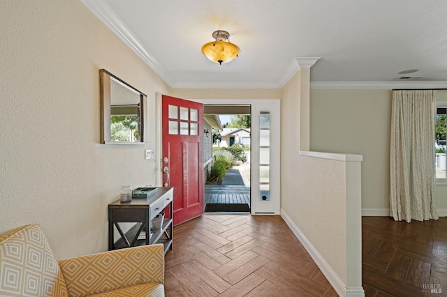 entryway featuring crown molding and baseboards