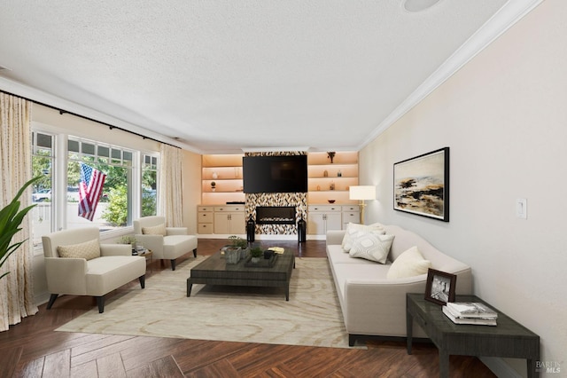 living room featuring a stone fireplace, a textured ceiling, and ornamental molding