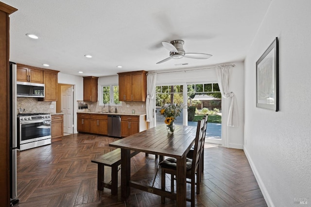 dining area featuring recessed lighting, baseboards, and ceiling fan