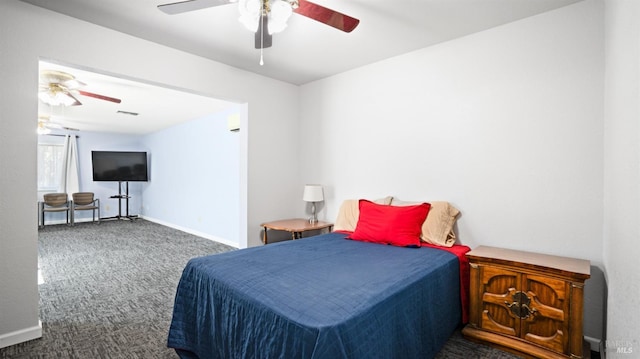 bedroom featuring carpet floors, baseboards, and a ceiling fan