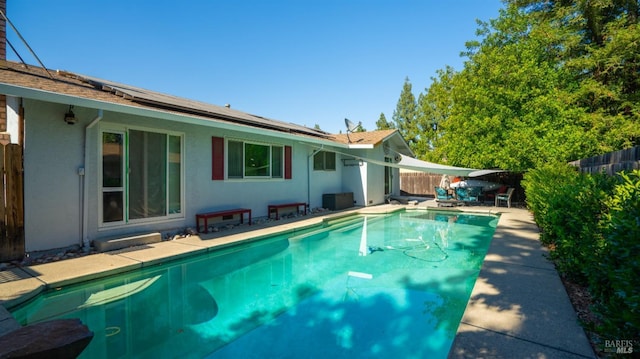 view of swimming pool with a fenced in pool, a patio area, and a fenced backyard