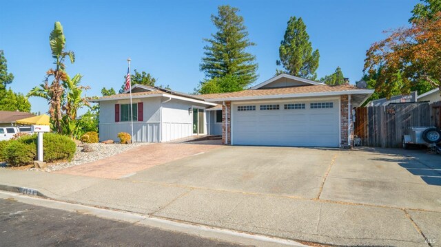 ranch-style home featuring a garage