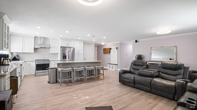 interior space with crown molding, sink, and light wood-type flooring