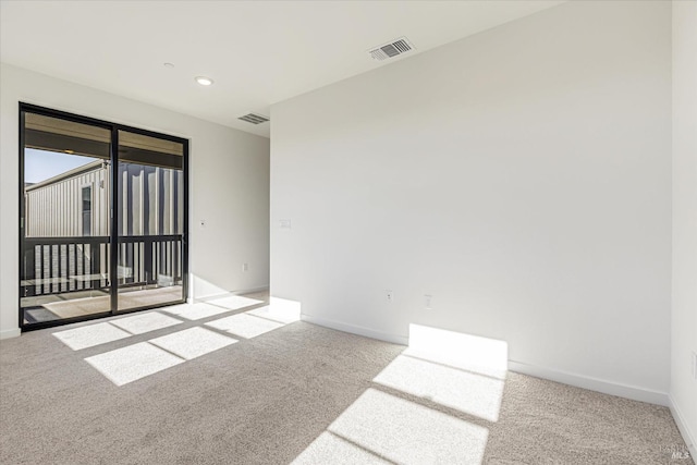 unfurnished room with light colored carpet