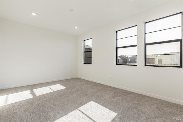 spare room featuring carpet flooring