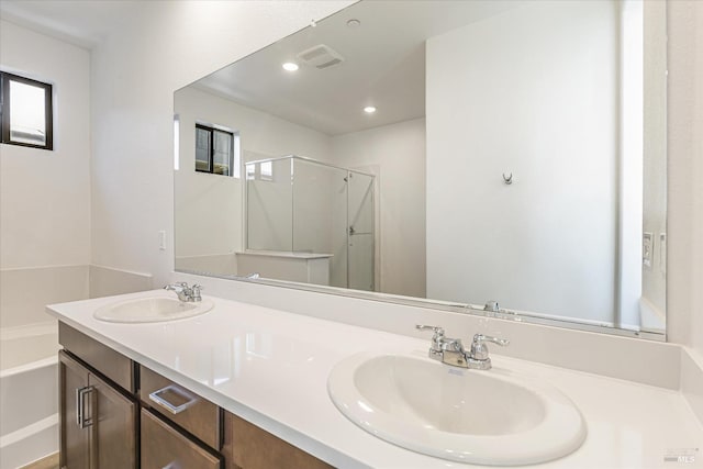 bathroom with vanity and plus walk in shower