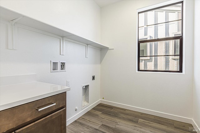 washroom featuring washer hookup, dark hardwood / wood-style floors, hookup for a gas dryer, and hookup for an electric dryer