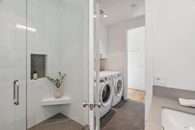 clothes washing area with laundry area and separate washer and dryer