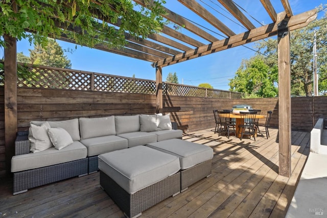 wooden deck featuring outdoor lounge area, a fenced backyard, outdoor dining area, and a pergola