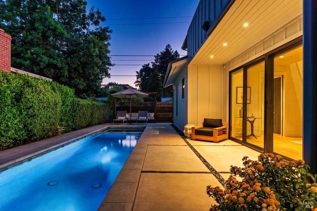 view of pool featuring a patio area, a fenced backyard, and a fenced in pool