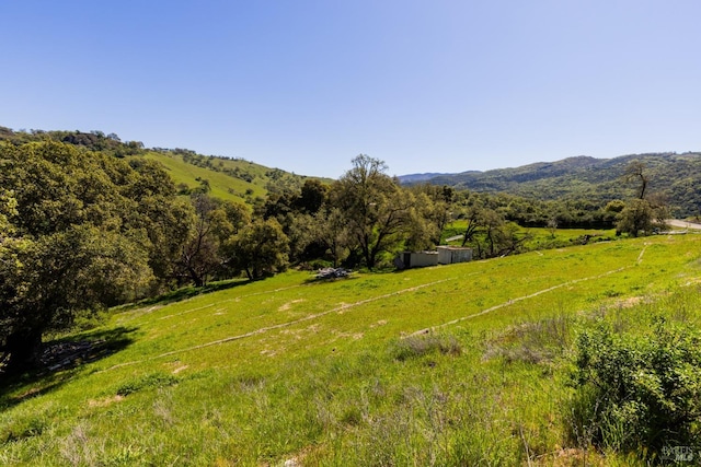 mountain view featuring a rural view