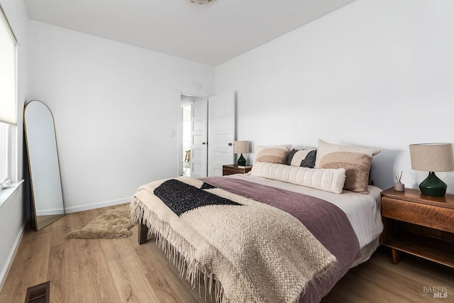 bedroom featuring light wood-type flooring