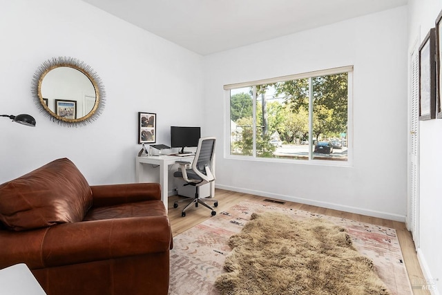 office space featuring light wood-type flooring