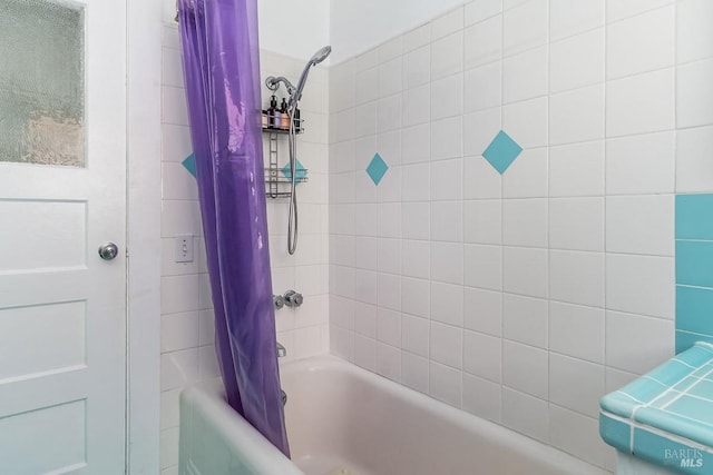 bathroom with shower / bath combo