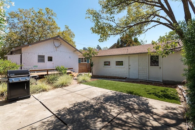 back of property with a patio