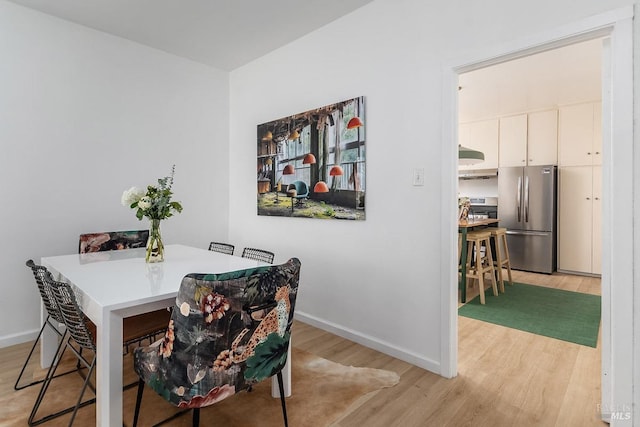 dining room with light hardwood / wood-style flooring