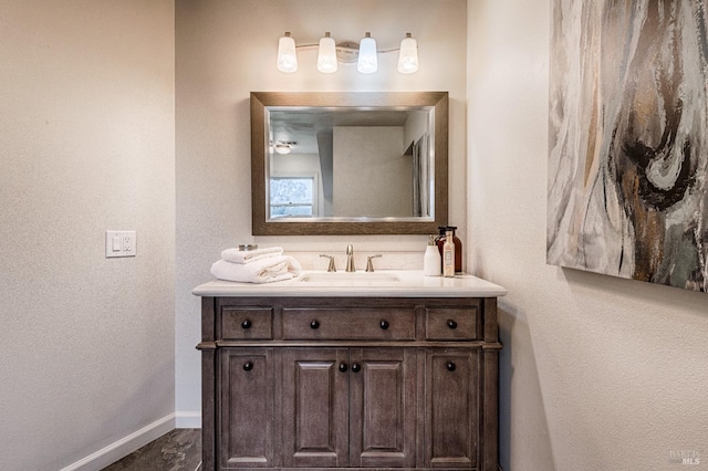 bathroom with vanity and baseboards