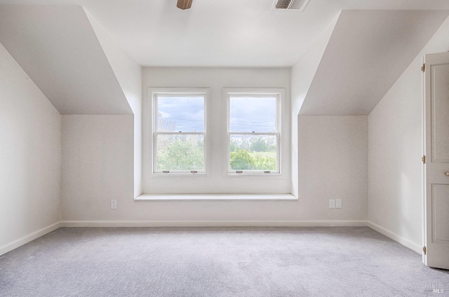 bonus room with carpet, vaulted ceiling, baseboards, and ceiling fan