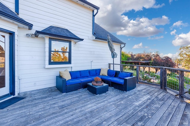 wooden terrace with an outdoor hangout area