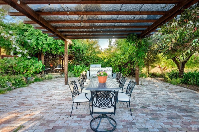 view of patio / terrace featuring outdoor dining area, a grill, and a pergola