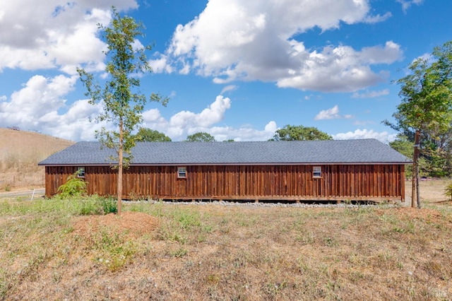 view of side of property with a wooden deck