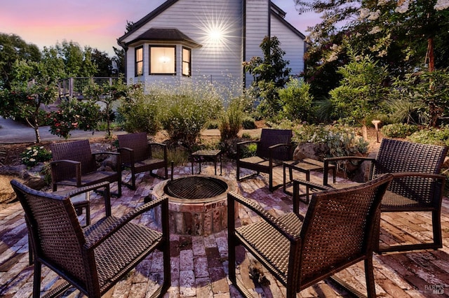 view of patio terrace at dusk