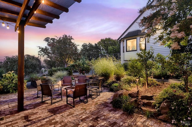 view of patio terrace at dusk