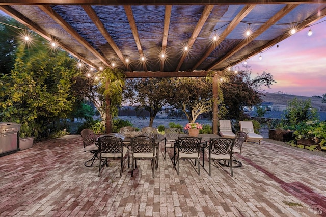 view of patio featuring outdoor dining space and a pergola