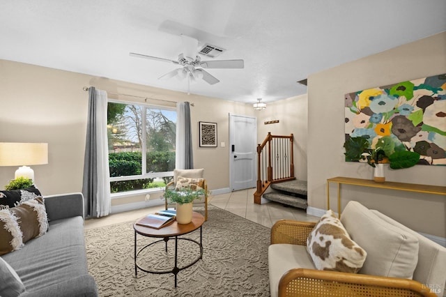 tiled living room with ceiling fan