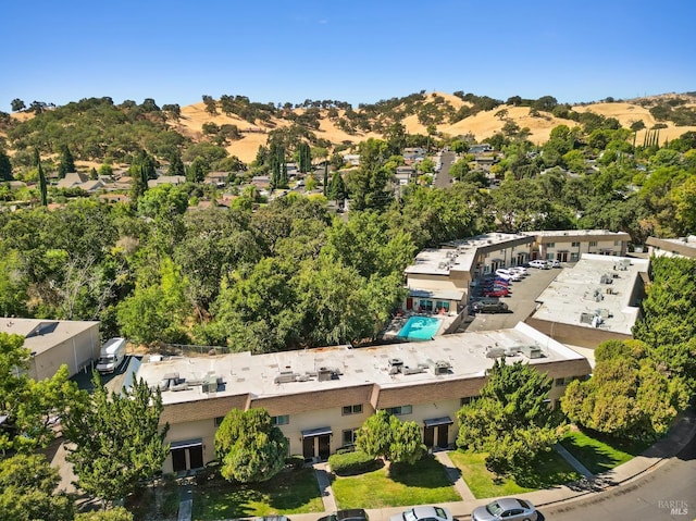 birds eye view of property with a mountain view