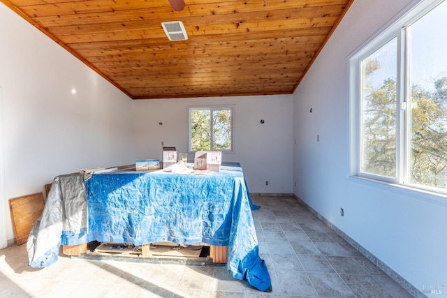 tiled bedroom with multiple windows, lofted ceiling, and wooden ceiling