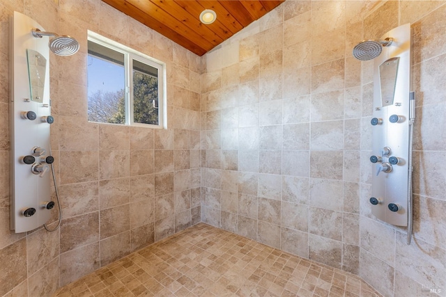 bathroom with a tile shower