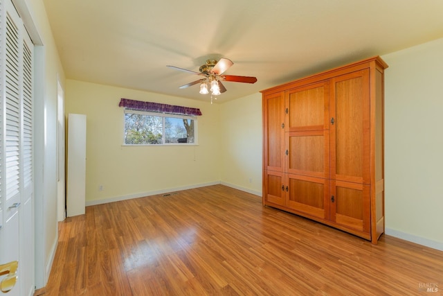 unfurnished bedroom featuring light hardwood / wood-style flooring and ceiling fan