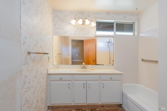 bathroom with vanity and a tub